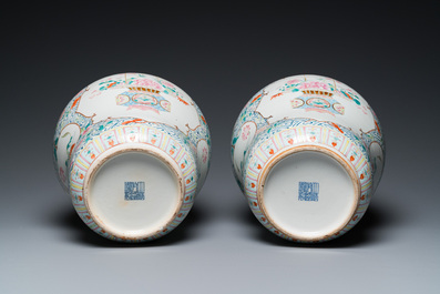 A pair of fine Chinese famille rose vases and covers, Qianlong mark, 19th C.