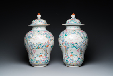 A pair of fine Chinese famille rose vases and covers, Qianlong mark, 19th C.