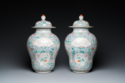 A pair of fine Chinese famille rose vases and covers, Qianlong mark, 19th C.