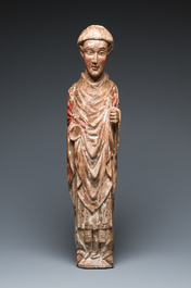 A large polychromed wood sculpture of a saint, Spain or Italy, 14th C.