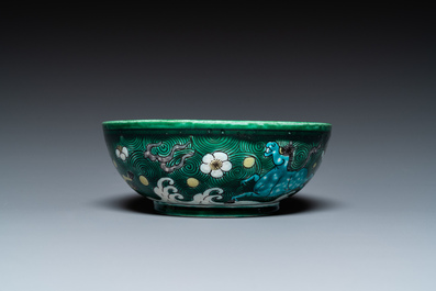 A Chinese verte biscuit 'galloping horses' bowl, Qing