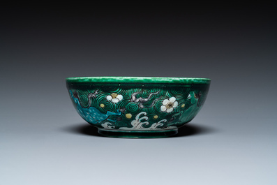 A Chinese verte biscuit 'galloping horses' bowl, Qing