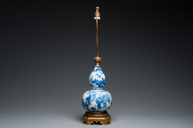 A Chinese blue and white double gourd vase mounted as a lamp, Transitional period