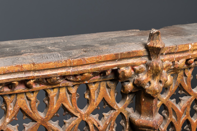 A large Spanish gilt and polychromed wooden tryptich retable with Saint John the Baptist, the Virgin Mary and Saint Roch, 1st half 16th C.