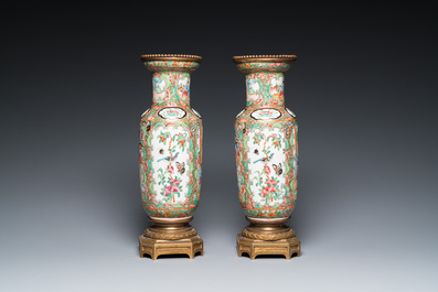 A Chinese octagonal famille rose 'mandarin' dish and a pair of bronze-mounted Canton vases, Qianlong and 19th C.