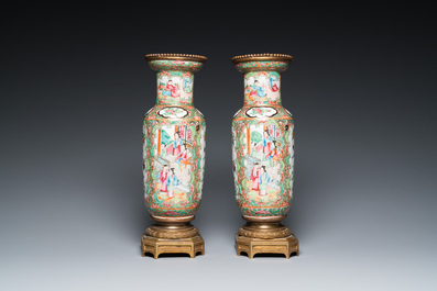 A Chinese octagonal famille rose 'mandarin' dish and a pair of bronze-mounted Canton vases, Qianlong and 19th C.