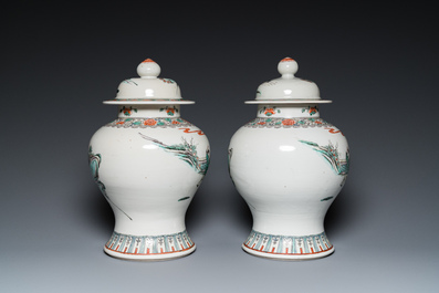 A pair of Chinese famille verte vases with covers and a pair of Nanking vases, 19th C.