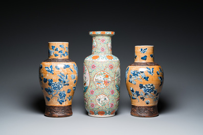 A Chinese Canton famille rose rouleau vase and a pair of Nanking vases, 19th C.