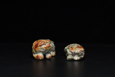 Two Chinese celadon and russet jade Buddhist lion sculptures, Qing