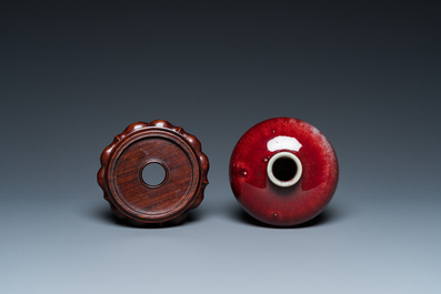 A Chinese peachbloom-glazed 'meiping' vase on wooden stand, 19th C.