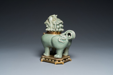 A Chinese gilt bronze-mounted Longquan celadon censer in the shape of a luduan, Ming