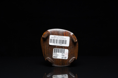 A Chinese hollowed jade libation cup on wooden stand, probably Qing