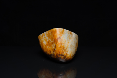 A Chinese hollowed jade libation cup on wooden stand, probably Qing