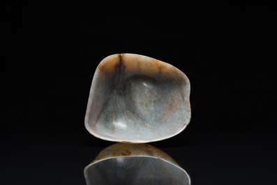 A Chinese hollowed jade libation cup on wooden stand, probably Qing