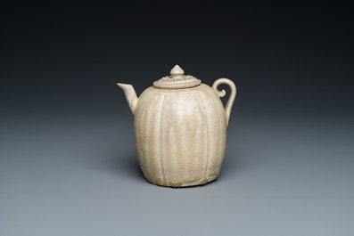 A Vietnamese beige-green-glazed melon-shaped ewer and cover, L&yacute;, 11/13th C.