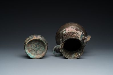 A Chinese ritual bronze 'hu' wine vessel and cover, Eastern Zhou or earlier