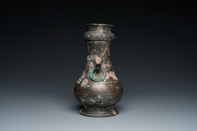 A Chinese ritual bronze 'hu' wine vessel and cover, Eastern Zhou or earlier