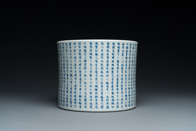 A Chinese blue, white and copper-red inscribed brush pot, Kangxi mark, 19/20th C.