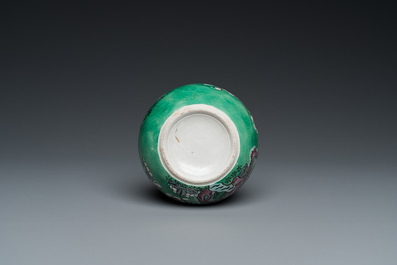 A Chinese verte biscuit 'prunus flowers' water pot, 19th C.