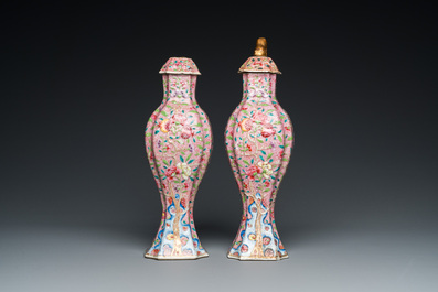 A pair of Chinese famille rose vases and covers, Yongzheng
