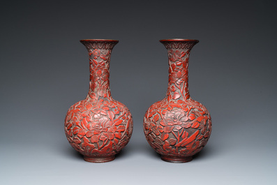 A pair of Chinese red cinnabar lacquer bottle vases, 19/20th C.