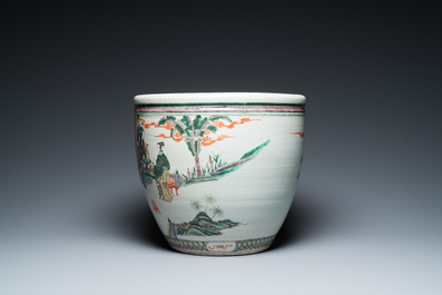 A Chinese famille verte fish bowl with female musicians in a garden, 19th C.