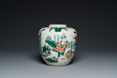 A Chinese famille verte jar with wooden cover and stand, 19th C.