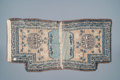 Two Chinese or Tibetan saddleback rugs, 19th C.