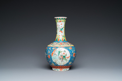 A Chinese famille verte bottle vase, Kangxi mark, 19/20th C.