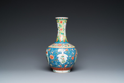 A Chinese famille verte bottle vase, Kangxi mark, 19/20th C.