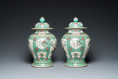 A pair of Chinese verte biscuit vases and covers, 19th C.