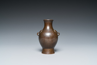 A Chinese silver-inlaid bronze 'hu' vase, 17/18th C.