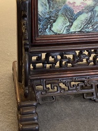 A Chinese famille rose plaque mounted as a table screen, Qianlong