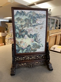 A Chinese famille rose plaque mounted as a table screen, Qianlong