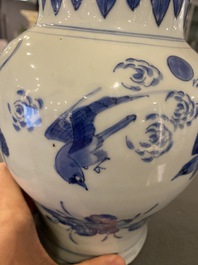 A Chinese blue and white vase with birds among blossoming branches, Transitional period