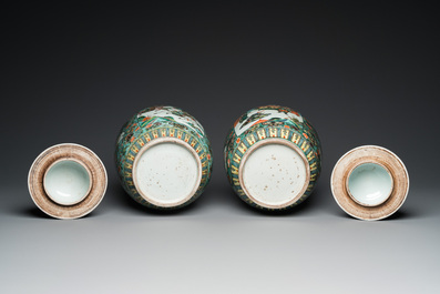 A pair of  Chinese famille verte vases and covers, 19th C.