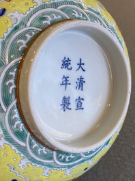 A Chinese yellow-ground famille rose 'dragon and phoenix' bowl, Xuantong mark and of the period