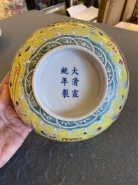 A Chinese yellow-ground famille rose 'dragon and phoenix' bowl, Xuantong mark and of the period