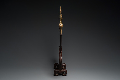 A Vietnamese wooden weapon rack with decorative weaponry, 19/20th C.