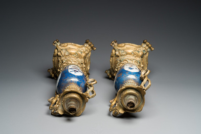 A pair of Chinese powder-blue vases with gilt bronze lamp mounts, Kangxi and 19th C.