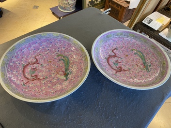 A pair of large Chinese pink-ground famille rose 'dragon and phoenix' dishes, 19th C.