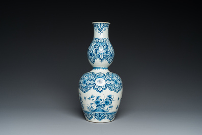 A Dutch Delft blue and white double gourd vase, 1st quarter 18th C.