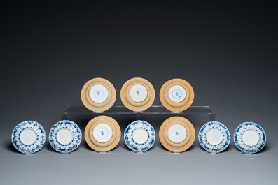 Eleven Chinese blue and white cups and ten saucers, Kangxi