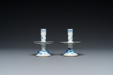 A pair of Chinese blue and white 'Bleu de Hue' candlesticks for the Vietnamese market, Kim Ngoc Cam Kee 金玉錦記 mark, 19th C.