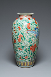 A very large Chinese famille verte 'dragon' vase on wooden stand, 19th C.