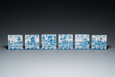 12 blue and white Dutch Delft tiles with continuous landscape scenes, 18th C.