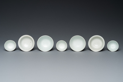 Four Chinese blue and white 'Hatcher cargo' bowls and three stem cups, Transitional period