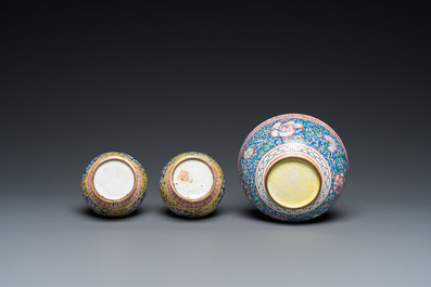 A pair of Chinese yellow-ground Canton enamel vases and a bowl, Yongzheng/Qianlong