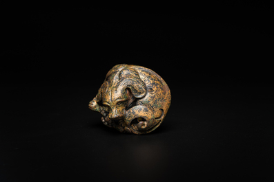 A Chinese gilt bronze &lsquo;dog&rsquo; scroll weight, Ming