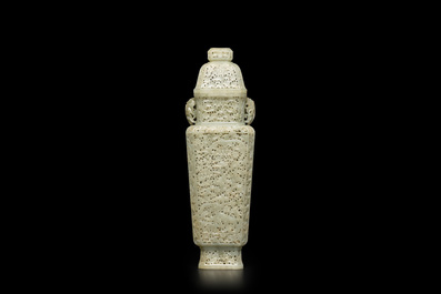 A Chinese reticulated celadon jade vase and cover, Republic